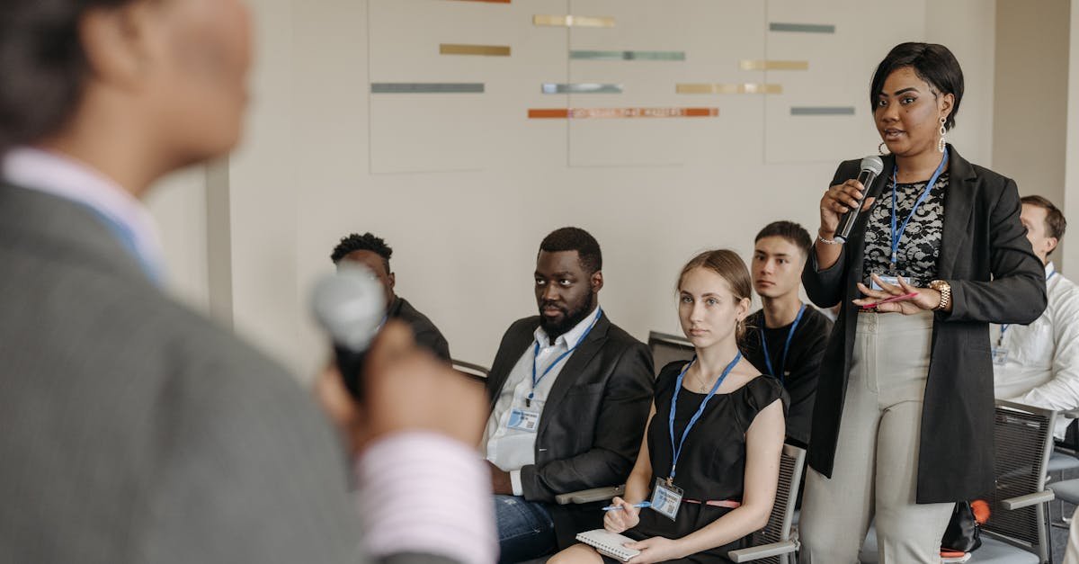 Engaged business discussion at a conference with diverse professionals participating.